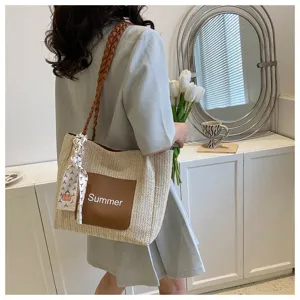 Stylish woven straw tote bag for women, large capacity casual shoulder bag with scarf decor.