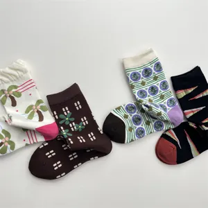 Detailed view of Korean style cute patterned cotton socks, colorful geometric and floral designs.