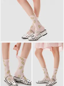 Close-up view of vintage floral print mid-calf socks in soft pink, perfect style details.