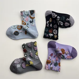 Four pairs of cute fruit and vegetable embossed mid-calf cotton socks for women, trendy design.
