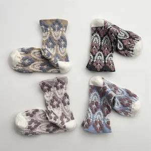 Vintage 3D relief floral knit mid-calf socks for women, cozy cotton breathable retro style.