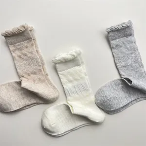 Breathable mesh baby cotton socks with cute bubble lace cuffs, solid color mid-tube design.