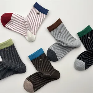 Detailed view of Korean style color-block striped mid-tube cotton socks with metal buckle.