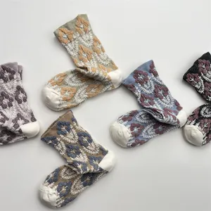 Close up shot of retro 3D relief floral cotton socks, textured Japanese style detail.