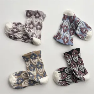 Retro floral mid-tube socks with 3D embossed design, soft breathable cotton for autumn winter.