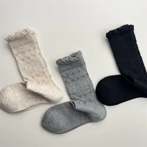 Detail view of breathable mesh slouchy socks with cute bubble lace trim, solid color soft cotton.