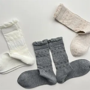Detail view of breathable mesh slouch socks with cute ruffle lace trim and soft cotton fabric.