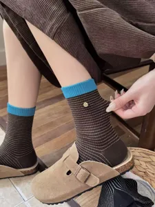 Brown striped mid-calf women socks with blue contrast cuffs and chic metal button detail.
