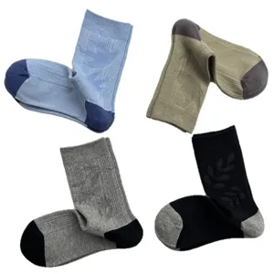 Minimalist jacquard mid-calf socks featuring subtle bird patterns, comfortable cotton casual wear.