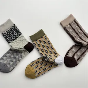 Women cotton mid-tube socks featuring stylish 3d embossed geometric patterns and contrast lines.