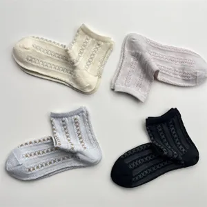 Close up view of the breathable mesh texture and vertical stripes on women summer short socks.