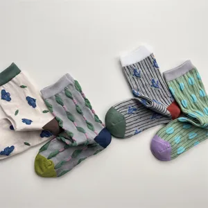 Detailed view of women's autumn winter retro floral patterned relief cotton crew socks
