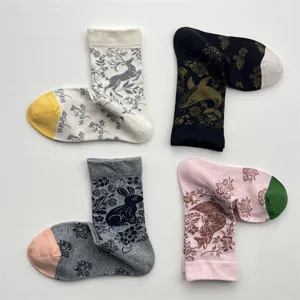Detailed display of retro animal floral cotton mid-tube socks with unique deer patterns