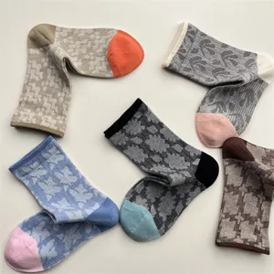 Retro Japanese geometric patterned cotton crew socks for women, stylish color block design.