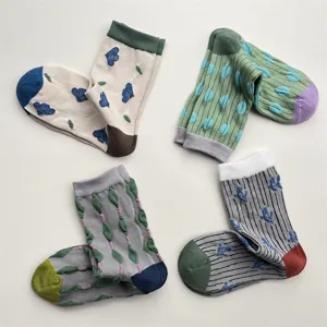 Cute vintage cotton mid-calf socks with contrast geometric patterns and embossed floral designs.
