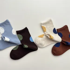 Detailed view of cute Japanese style polka dot mid-tube socks, featuring colorful soft cotton.