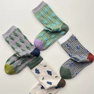 Detailed view of women retro mid-calf socks featuring cute textured relief patterns & colors.