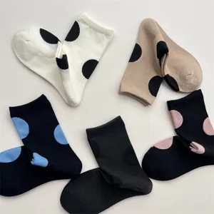 Detailed view of cute polka dot mid-calf socks showing soft cotton texture and colors.