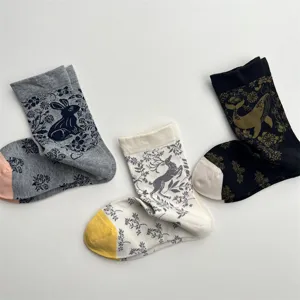 Retro botanical animal pattern mid-calf cotton socks with rabbit, deer, and whale details.