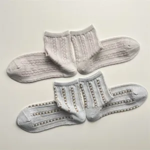 Detail shot of vintage striped mesh breathable short socks, soft cool-feeling yarn fabric.