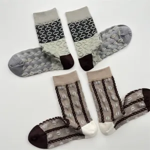 Detailed view of women's textured mid-calf socks featuring geometric relief patterns.