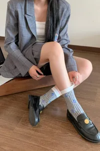 Cute vintage style striped mid-calf socks for women, retro aesthetic daily wear accessory.