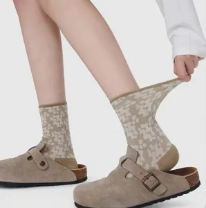 Detailed view of women's vintage geometric patterned mid-tube cotton socks in beige.