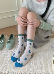 Retro cotton mid-calf socks with cute floral patterns and contrast cuffs for women.