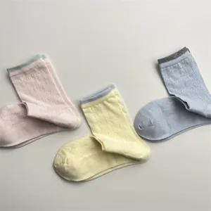 Detail shot of breathable mesh mid-tube socks with cute vine pattern and color block cuffs.