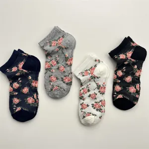 Detailed view of women short socks with retro rose floral pattern, breathable mesh design.