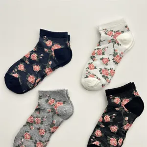Detailed close-up view of stylish breathable mesh short socks with retro rose floral patterns.