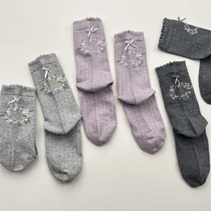 Sweet floral bow cotton mid-tube socks for women, cute autumn winter casual hosiery.