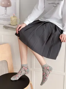 Close-up of breathable mesh short socks featuring delicate rose patterns, ideal for spring wear.