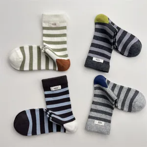 Casual striped cotton mid-calf socks for women, breathable color-block korean style daily wear.