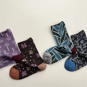 Detailed view of women's vintage relief floral and geometric patterned cotton mid-tube socks for autumn.