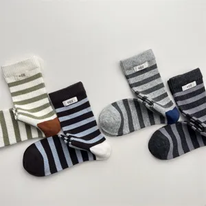 Stylish striped cotton mid-tube socks for women featuring cozy contrast color design