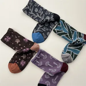 Vintage embossed floral cotton mid-calf socks for women, stylish autumn winter footwear.