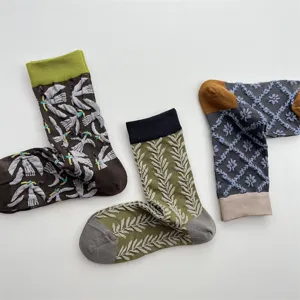 Details of Japanese vintage embroidered cotton mid tube socks featuring cute birds and flowers.