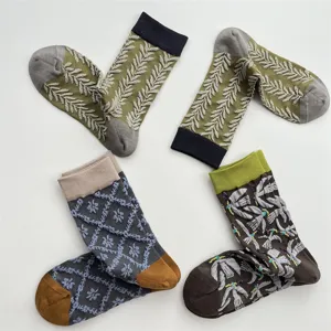 Close-up details of Japanese retro relief socks featuring unique bird and floral patterns.