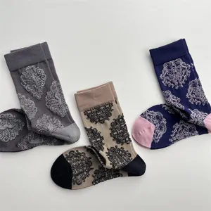 Detailed view of retro 3D embossed floral cotton mid-calf socks in elegant vintage colors.