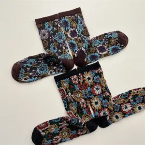 Details of vintage ethnic floral embossed socks, retro botanical cotton mid-calf sock texture.