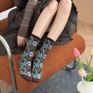 Details of retro floral mid-calf socks for women featuring vintage botanical cotton fabric.