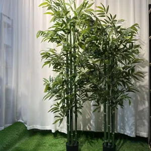 Artificial bamboo plant for indoor and outdoor decoration, realistic green leaves in pot.