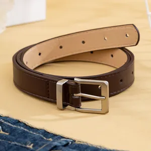 Close-up of a stylish dark brown PU leather women belt with a sleek silver pin buckle accessory.