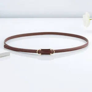 Slim brown leather belt close-up featuring minimalist golden metal buckle and neat edge stitching.