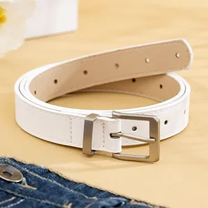 Detailed view of a minimalist white PU leather belt featuring a sleek silver metal pin buckle.