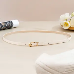 Close-up detail of the slim beige PU leather belt featuring a sleek gold-tone pin buckle.