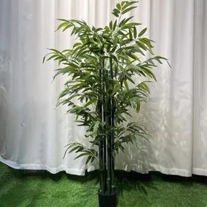 Artificial bamboo plant detail, vibrant green leaves and realistic stalks for indoor decor.