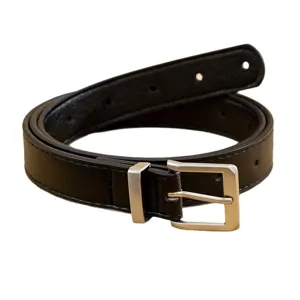 Minimalist women black PU leather belt with silver pin buckle, stylish suit trouser accessory.
