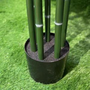 Artificial bamboo potted plant detail shot green bamboo poles with black pot for decor